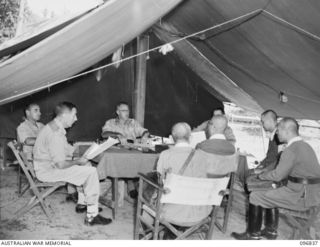 MALAGUNA, NEW BRITAIN. 1945-09-17. MAJOR GENERAL K.W. EATHER, GENERAL OFFICER COMMANDING 11 DIVISION, AND STAFF OFFICERS IN CONFERENCE WITH GENERAL H. IMAMURA, COMMANDANT EIGHTH AREA ARMY AND ..