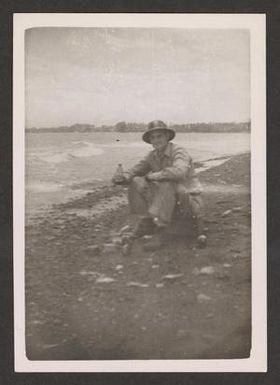 [Man Sitting by Coast]