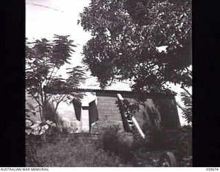 BOMANA, NEW GUINEA. 1943-11-08. ONE OF THE CAMOUFLAGED RESERVOIRS OF THE BOMANA PUMPING STATION. AFTER FILTRATION THE WATER IS STORED HERE BEFORE BEING PUMPED TO PORT MORESBY