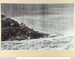 NEW GUINEA, 1943-09-05. TROOPS CROSSING AT THE MOUTH OF THE BUSO RIVER AFTER THE 9TH DIVISION'S LANDING AT RED BEACH. (RAAF -1664-8)