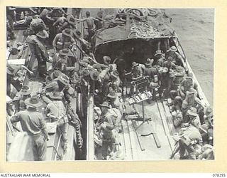 SIPAAI, BOUGAINVILLE ISLAND. 1945-01-07. TROOPS OF THE 31/51ST INFANTRY BATTALION TRANSFERRING FROM THE VESSEL AV1361 "POOLTA" TO A LANDING BARGE OF THE 42ND LANDING CRAFT COMPANY AS THE UNIT ..