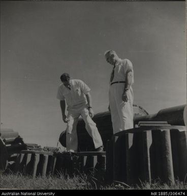 Officers inspecting machinery gears