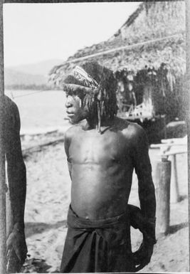 Man standing in front of a building, Ramu River, New Guinea, 1935 / Sarah Chinnery