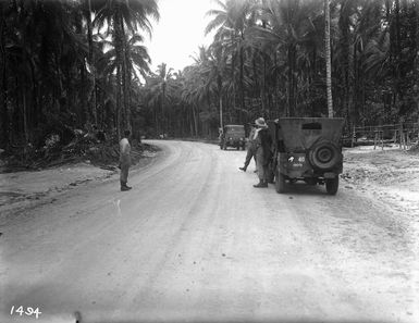 The Commander Regimental Engineers, inspecting a completed road on Vella Lavella Island, Solomon Islands, during World War II