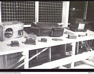 TOROKINA, BOUGAINVILLE, 1945-12-07. EXAMPLES OF CABINET MAKING AND FRENCH POLISHING AT THE ARTS AND CRAFTS EXHIBITION HELD AT TOROKINA. MANY OF THE ENTRANTS ARE STUDENTS AT THE TOROKINA ..