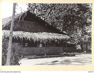 LAE AREA, NEW GUINEA, 1945-08-10. THE SIDE VIEW OF THE CHARING CROSS EDUCATION HUT UNDER THE COMMAND OF THE DEPUTY ASSISTANT DIRECTOR OF EDUCATION, LAE BASE SUB-AREA