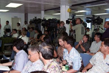 Members of the International News Media gather at Pearl Harbor, Hawaii (HI), during a press briefing used to describe the lifting process for the Japanese fishing vessel Ehime Maru