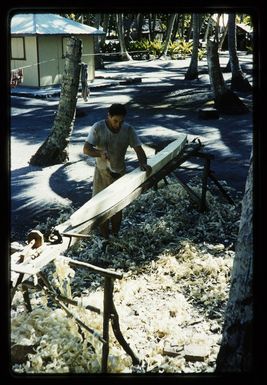 Joseph Teinangaro (Lost Young Brother) Marsters shaping a canoe outrigger, on Palmerston Island