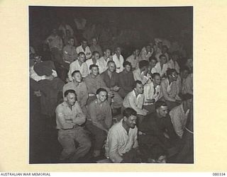 LAE, NEW GUINEA. 1944-08-01. PATIENTS AT THE 2/7TH GENERAL HOSPITAL, AUSTRALIAN ARMY MEDICAL CORPS AT THE "THE WHITE HORSE INN" PRODUCTION STAGED BY MEMBERS OF THE STAFF