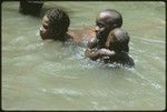 Girls swimming in the creek running by Uka'oi