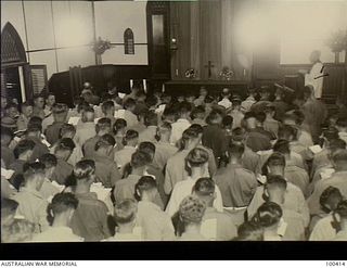 Port Moresby, New Guinea. 1944-05-14. Interior of St John's Church of England during a church service attended by men and women of the Australian Forces