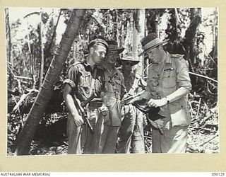 COMPTON RIVER AREA, BOUGAINVILLE. 1945-03-31. LORD WAKEHURST, GOVERNOR OF NEW SOUTH WALES (3), LIEUTENANT-GENERAL S.G. SAVIGE, GENERAL OFFICER COMMANDING 2 CORPS (2), AND PRIVATE A. BAMBACK ..