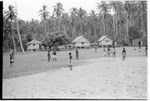 Playing a sport on a village field