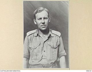 NAMANULA, NEW BRITAIN. 1945-10-22. CAPTAIN R.J. MCINTYRE, CATERING OFFICER HEADQUARTERS 11 DIVISION