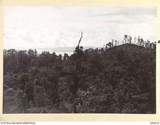 WEWAK AREA, NEW GUINEA, 1945-07-14. THE PANORAMA FROM "THE BLOT" AFTER ITS CAPTURE BY A COMPANY, 2/8 INFANTRY BATTALION, WITH B COMPANY IN SUPPORT. AT THE RIGHT IS MOUNT SHIBURANGU; ON THE LEFT IS ..