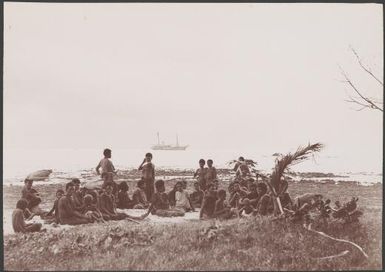 Ni-Vanuatu women on beach at Mota Lava and Southern Cross at sea in background, Banks Islands, 1906 / J.W. Beattie