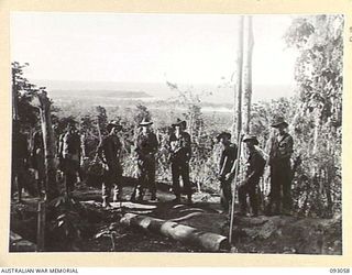 WEWAK AREA, NEW GUINEA, 1945-06-11. MORTAR PLATOON, 2/8 INFANTRY BATTALION TROOPS TAKEN WITH WEWAK POINT IN THE BACKGROUND. IDENTIFIED PERSONNEL ARE:- PTE D.F. BYRNE (2); PTE E.M. ANABLE (3); PTE ..