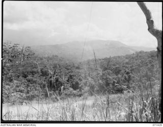 FINSCHHAFEN AREA, NEW GUINEA. 1944-03-21. A SECTION OF A PANORAMA FROM THE AREA OF HEADQUARTERS, 2ND AUSTRALIAN CORPS, NORTH HILL IN THE FOREGROUND WITH SCARLET BEACH AND SATTELBERG AWAY TO THE ..