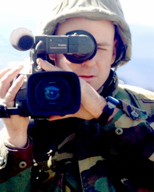 US Marine Corps Lance Corporal Beebe, a videographer from the Marine Corps Base Kaneohe Bay, Hawaii, Combat Visual Information Center, shoots video at the Pohakuloa Training Area, Hawaii, grenade range during a Hawaiian Combined Arms Operation. (Substandard image)