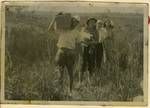 Art students walking through field of wild grass, North Stradbroke Island, 1949