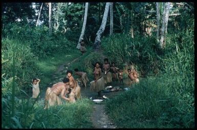 Women washing and peeling vegetables : Goodenough Island, D'Entrecasteaux Islands, Papua New Guinea, 1956-1958 / Terence and Margaret Spencer