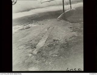 New Guinea. C. 1944. Aerial view of an airfield landing strip