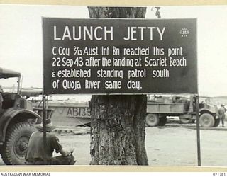 FINSCHHAFEN AREA, NEW GUINEA. 1944-03-20. ONE OF MANY BATTLE SIGNS IN THE FINSCHHAFEN AREA, THIS SIGN RECORDS THE ACTIVITIES OF C COMPANY, 2/13TH INFANTRY BATTALION