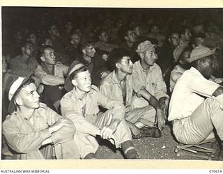 PORT MORESBY, PAPUA, 1944-02-25. AUSTRALIAN AND AMERICAN TROOPS VIEWING A PICTURE SHOW FROM THE GROUNDS AT AN AMERICAN HOSPITAL