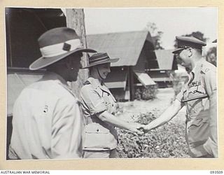 TOROKINA, BOUGAINVILLE. 1945-07-03. HIS ROYAL HIGHNESS, THE DUKE OF GLOUCESTER, GOVERNOR-GENERAL OF AUSTRALIA (2), BEING GREETED BY MATRON M.E. HURLEY (1) AND COLONEL J. LEAH, COMMANDING OFFICER, ..