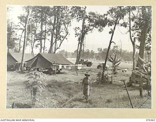 LAE, NEW GUINEA. 1944-10-03. THE MEN'S LINES AND THE TRANSPORT SECTION OF HEADQUARTERS 6TH INFANTRY BRIGADE ON THE BUTIBUM ROAD