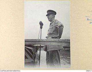 WEWAK AIRSTRIP, NEW GUINEA. 1945-09-03. MAJOR GENERAL H.C.H. ROBERTSON, GENERAL OFFICER COMMANDING 6 DIVISION, ADDRESSING TROOPS OF 2/4, 2/8 AND 2/11 INFANTRY BATTALIONS DURING A BRIGADE PARADE AT ..