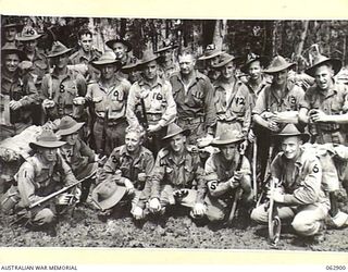 RAMU VALLEY, NEW GUINEA. 1944-01-16. PERSONNEL OF HEADQUARTERS AND THE MORTAR DETACHMENT, B COMPANY, 57/60TH INFANTRY BATTALION. THEY ARE: PRIVATE K. GREIG (1); PRIVATE J. PHELAN (2); SERGEANT N. ..