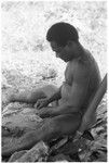 Man working with kofu shell money