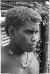 Portrait of boy with shell money and dolphin teeth necklace