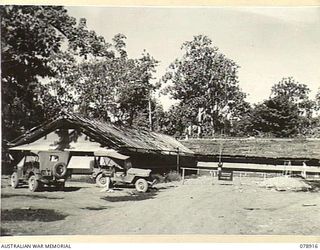 LAE, NEW GUINEA. 1945-02-06. THE NEW SIGNALS OFFICE HEADQUARTERS, FIRST AUSTRALIAN ARMY. THE RIGHT WING IS THE WIRELESS OPERATING ROOM THE LEFT WING HOUSES THE LINE INSTRUMENT OPERATORS, CLERKS ETC