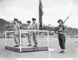 PORT MORESBY, NEW GUINEA. 1944-04-28. NX34705 BRIGADIER P. S. MCGRATH, OBE, DEPUTY DIRECTOR OF SUPPLY AND TRANSPORT, HEADQUARTERS NEW GUINEA FORCE (1), TAKES THE SALUTE DURING THE MARCH PAST OF THE ..