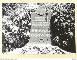 ELA BEACH, PORT MORESBY. 1954-08. A BRONZE MEMORIAL PLAQUE ERECTED ON A STONE BASE NEAR THE MEMORIAL CEMETERY AT ELA BEACH, TO COMMEMORATE THE SERVICES OF THE MEN AND WOMEN OF THE TERRITORY WHO ..