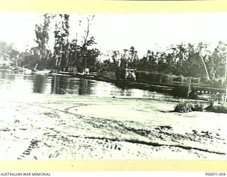 BOUGAINVILLE ISLAND, SOLOMON ISLANDS, 1945. 'TAGESSI' PONTOON BRIDGE - SCENE OF TRAGIC DISASTER 1945-01-11. ELEVEN AUSTRALIANS DROWNED