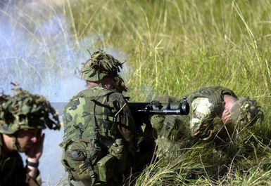 Marines from India Company, 3rd Battalion, 3rd Marines weapon platoon, Kaneohe Bay, Hawaii fire their AT-4 Rocket Launchers on May 25, 2001 during Exercise TANDEM THRUST. India Company is conducting a live fire range exercise consisting of firing AT-4 Rocket Launchers, Shoulder Mounted Anti Armor Weapons, and M-2O3 Grenade Launchers at the Shoalwater Bay Training Area. TANDEM THRUST is a combined United States and Australian military training exercise. This biennial exercise is being held in the vicinity of Shoalwater Bay Training Area, Queensland, Australia. More than 27,000 Soldiers, Sailors, Airmen and Marines are participating, with Canadian units taking part as opposing forces. The...