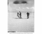 Dr. Lauren R. Donaldson, Captain Christian L. Engleman and Lieutenant Commander William R. Richardson observing fish near Uku Island, 1947