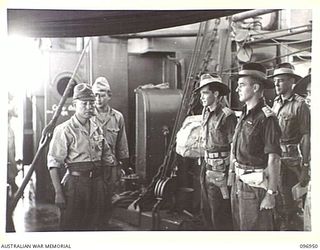 BOUGAINVILLE, 1945-09-18. MAJOR GENERAL K. KIJIMA, WITH LIEUTENANT H.J. JENKINS, CAPTAIN W. DAVIES AND LIEUTENANT COLONEL W. RUSSELL, MEMBERS OF THE AUSTRALIAN SURRENDER PARTY ABOARD THE DEBORAH. ..