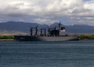 The Japanese Maritime Self-Defense Force fleet support ship TOWADA (AOE-422) departs from the naval station after a visit.