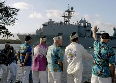 Pearl Harbor survivors wave to the U.S. Navy Amphibious Assault Ship USS PEARL HARBOR (LSD 52) at Pearl Harbor, Hawaii, on Dec. 8, 2006, during the joint Navy/National Park Service ceremonies commemorating the 65th Anniversary of the attack on Pearl Harbor. More than 1,500 Pearl Harbor survivors, their families and their friends from around the nation joined the more than 2,000 distiguished guests and the general public for the annual Pearl Harbor observance. (U.S. Navy photo by Mass Communication SPECIALIST 2nd Class Lindsay J. Switzer) (Released)
