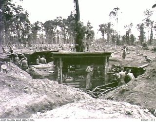 THE SOLOMON ISLANDS, 1945-04-24/27. GENERAL VIEW OF AN AUSTRALIAN 25 POUND GUN POST UNDER ESTABLISHMENT ON BOUGAINVILLE ISLAND. (RNZAF OFFICIAL PHOTOGRAPH.)