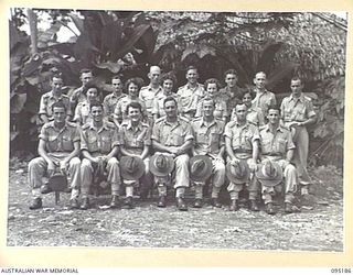 LAE AREA, NEW GUINEA, 1945-08-15. COLONEL R.W. SAVIGE WITH MEMBERS OF THE CHIEF SIGNAL OFFICER STAFF, AT HEADQUARTERS FIRST ARMY