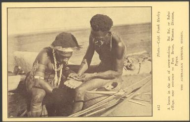 A lesson in the art of arrow-making, Bai Bai, or Babai village, near entrance to Port Bevan, Western Division, Papua / photo. Capt. Frank Hurley