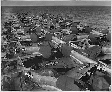 Flight Deck, USS CASABLANCA. Flight deck load, aircraft, P-47NE5, aft. Planes loaded at Naval Air Station in Alameda, California, enroute to Guam, from San Francisco.