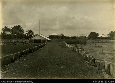 Daru, Customs House and quarters in centre, boat shed in foreground