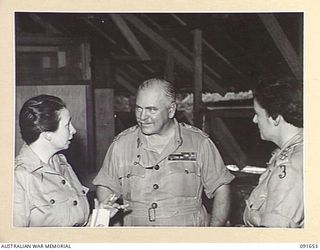 LAE, NEW GUINEA. 1945-05-11. GENERAL SIR THOMAS A. BLAMEY, COMMANDER-IN-CHIEF, ALLIED LAND FORCES, SOUTH WEST PACIFIC AREA (2), TALKING WITH CAPTAIN F.M.H. IRVING, PUBLIC RELATIONS OFFICERS, ARMY ..