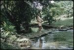 Anne Scheffler standing beside a creek